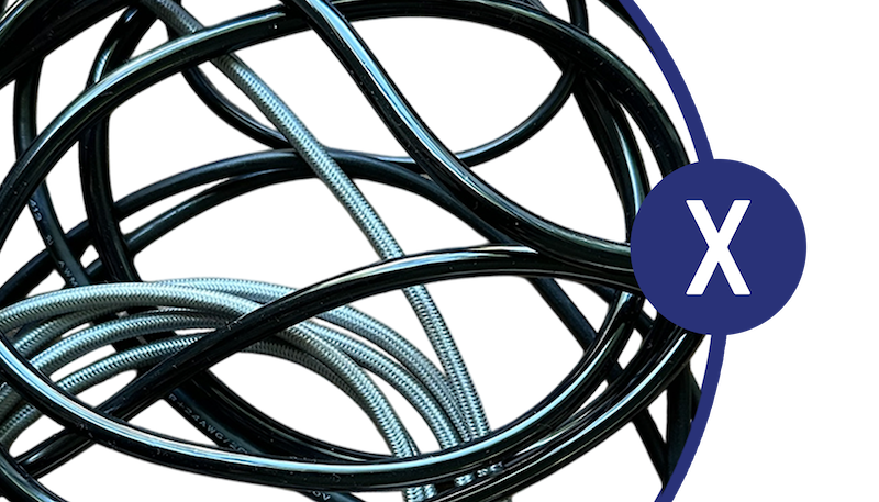 Tangled sensor cables representing traditional wired crankshaft measurement setup