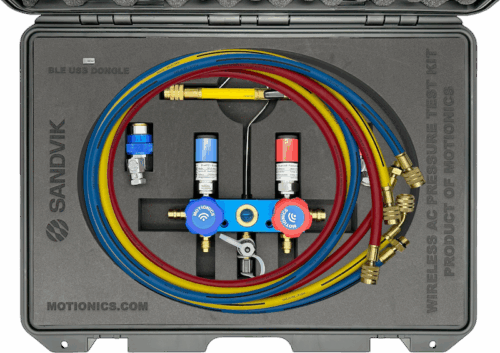 Interior view of Sandvik SHOT AC Kit by Motionics with wireless valves, pressure sensors, and color-coded hoses