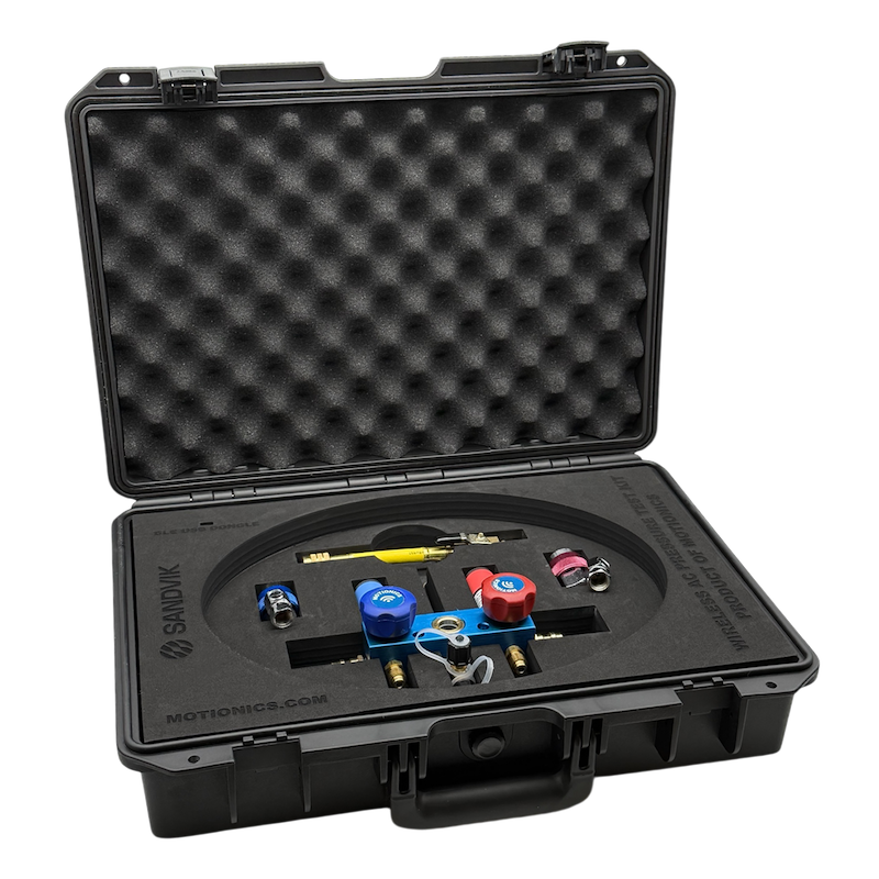 Sandvik SHOT AC Kit open case displaying wireless accessory components including valves, fittings, and couplings by Motionics