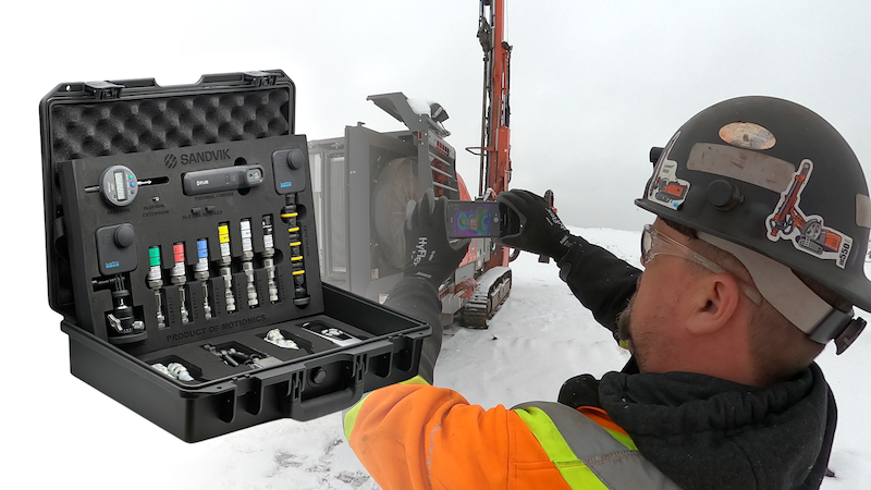 Field application of Sandvik SHOT Kit by Motionics with technician using tablet for thermal inspection of Sandvik machinery