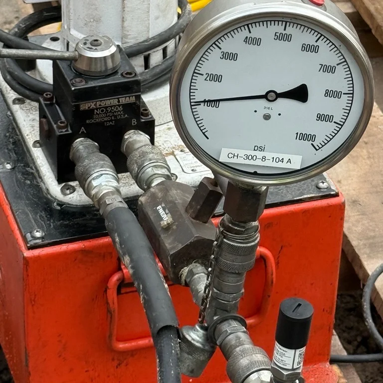 BluePSI is a Bluetooth Pressure Sensor that connects directly to a hydraulic jack’s pressure port using a standard 3/8" Quick Connect Coupler, allowing fast tool free attachment and immediate inline pressure reading. During load tests, the sensor captures real-time hydraulic pressure and MultiGage converts it into applied load based on the jack’s calibration chart, giving you accurate wireless monitoring from a safe distance. This setup replaces analog gauges, reduces human error and streamlines testing by delivering reliable load data directly to your phone, tablet or computer. #BluePSI #WirelessMeasurement #InTheField Ref: [1208251055]